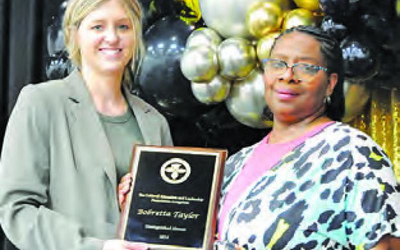 CELF PRESIDENT Krista Zwernemann presents Bobretta Taylor was the Distinguished Alumi Award during last Friday’s Bright Stars Breakfast. -- Tribune photo by Denise Squier