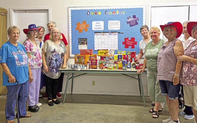 THE LYONS EDUCATION Extension Association (EEA) presented Willie Hobbs from Elizabeth Lutheran Church food pantry with a food donation during a recent EEA meeting . Photo courtesy of Lyons EEA