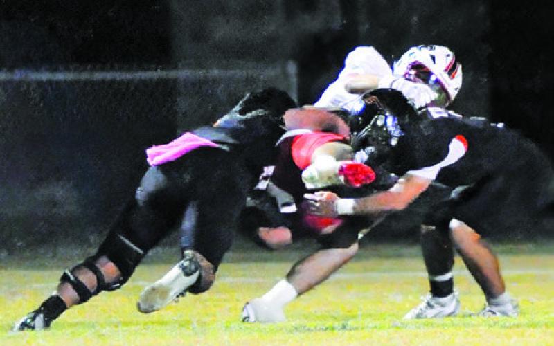 SOMERVILLE’S MARTIN ESPINOZA and Jayden Young make a tackle against Burton during the 2025 Somerville High School homecoming game. Tribune photo by Denise Squier