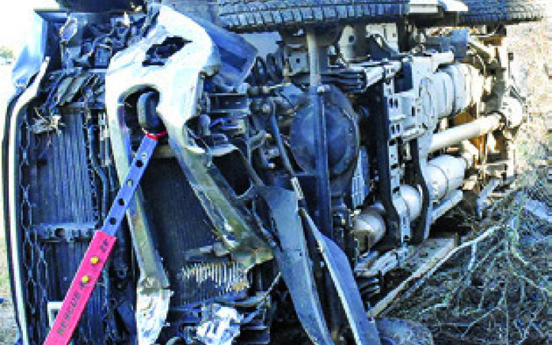 THIS TRUCK IS damaged on Monday in a fatal accident off County Road 123. Tribune photo by Roy Sanders