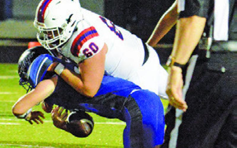BRAYDEN MACIK of Snook is tackled by a St. Stephen’s defender last Friday in Snook. Tribune photo by Kim Hutcheson