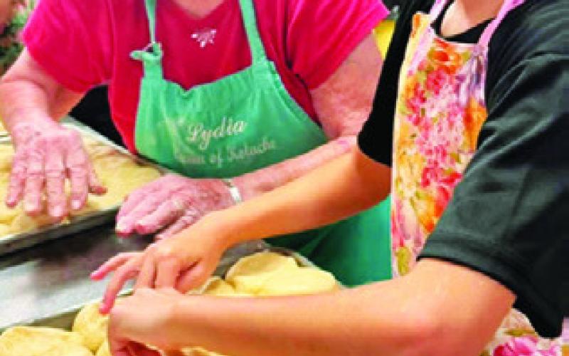 KOLACHE QUEEN Lydia Faust shares her baking knowledge to the next generation of kolache bakers at the annual kolache baking school for the Snook SPJST Youth Club.