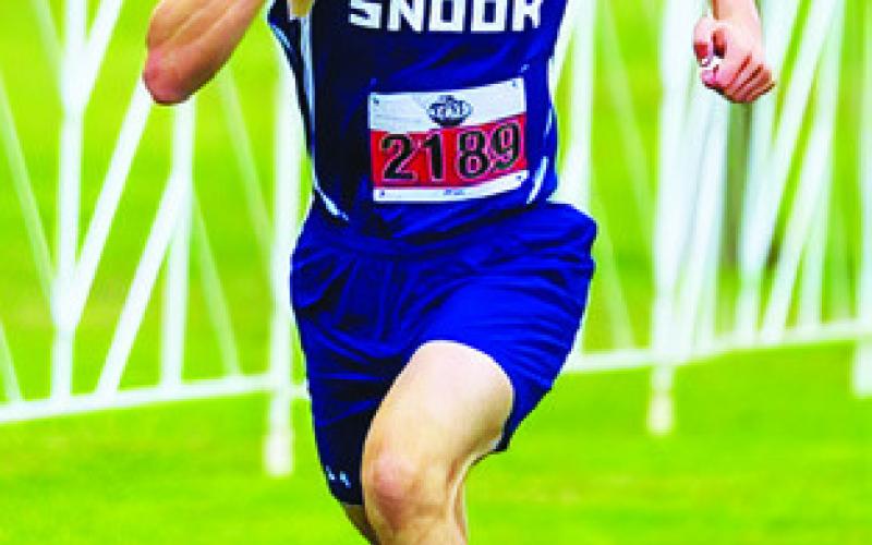 ETHAN JANAC runs at the state cross country meet at Old Settler’s Park in Round Rock.