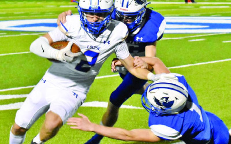 SILAS HETLAND AND Liam Zequeira make a tackle against Louise in the Bluejays’ 35-22 loss. -- Tribune photo by Roy Sanders