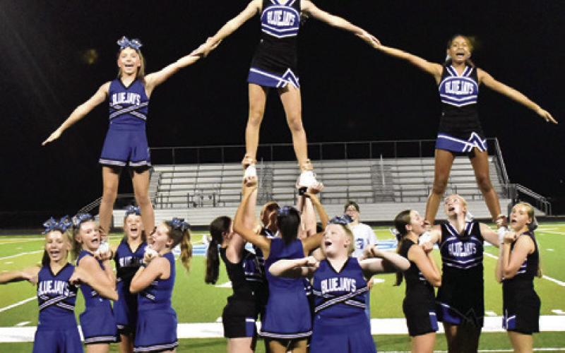 THE SNOOK HIGH School cheerleaders lead the cheers on Friday night during Meet the Bluejays.