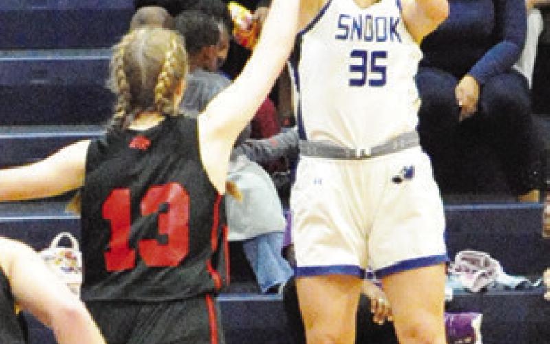 MACKENZIE GROCE shoots the ball during the Snook-Richards game last Tuesday afternoon in Snook.