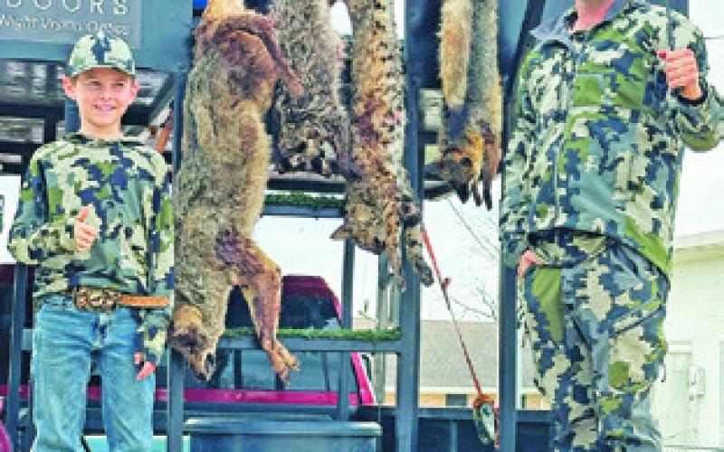 JEFF BALDWIN, right, helped coordinate the varmint hunt.