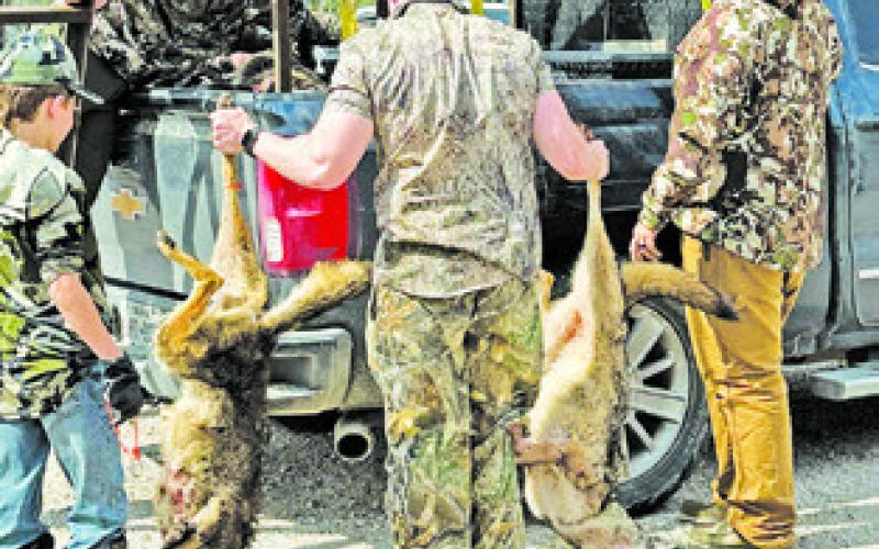 HUNTERS CHECK IN on Sunday at the Deanville Fire Station.