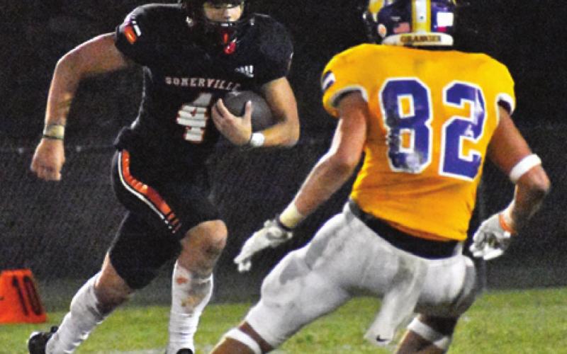 SOMERVILLE’S JOHNNY LEGG runs to daylight against Granger.