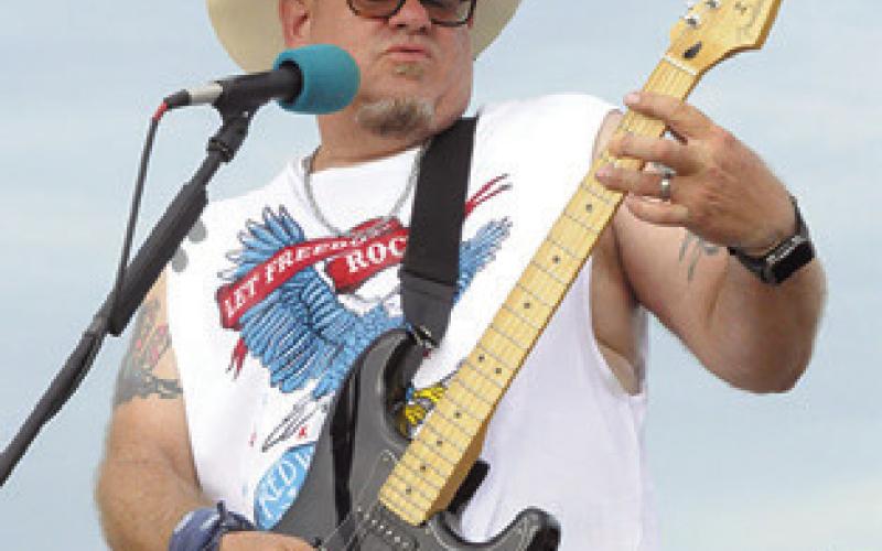 MATT KELLY WITH the band Sweet Baby Mayhem rocked Lake Somerville during the Fourth of July Celebration at Welch Park. Tribune photo by Denise Squier