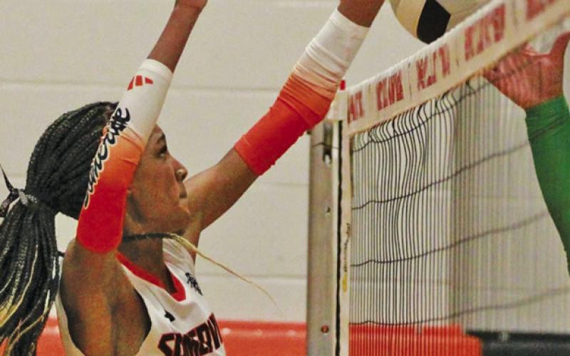 SOMERVILLE’S KARYS ELLIS dominates the net during the Lady Yeguas’ win over Hempstead on Friday at the elementary gym.