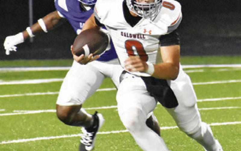COY BECKA of Caldwell breaks lose for another run against Crockett.
