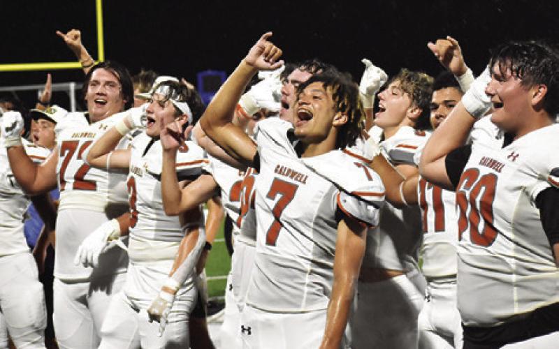 THE HORNETS CELEBRATE a victory over Crockett last Friday in the season opener. Tribune photo by Roy Sanders