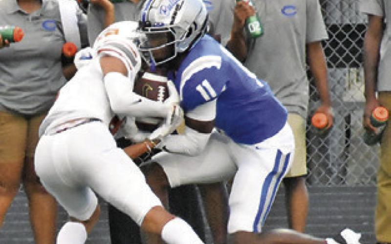 A CALDWELL Hornet makes a catch against Crockett. Tribune photo by Roy Sanders