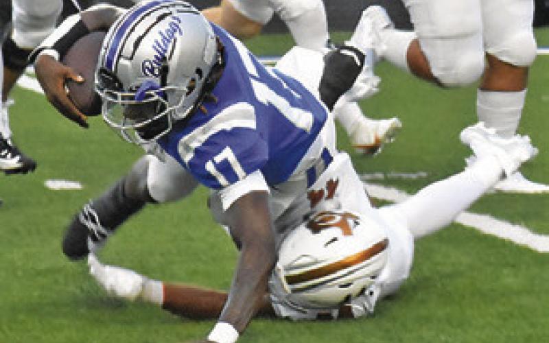ZANE BROWN of Caldwell makes a tackle against Crockett. The Hornets won 35-34.