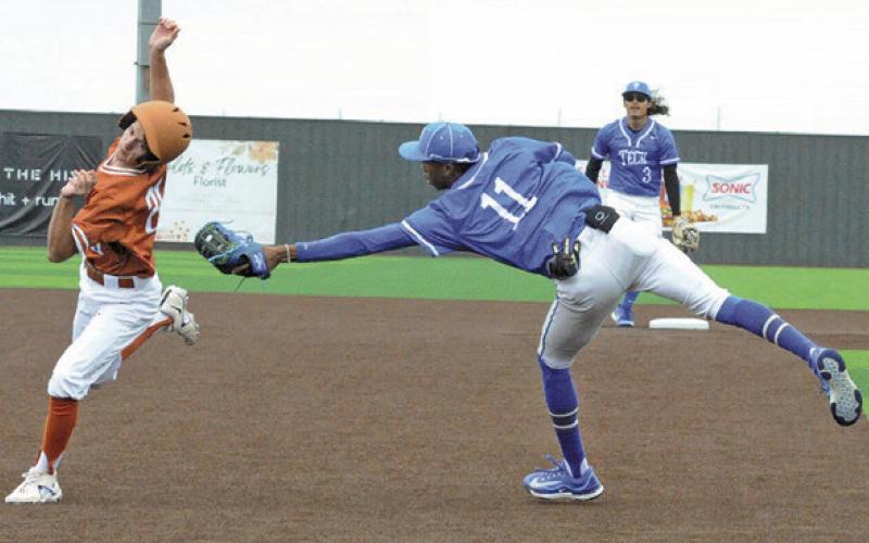 DANIEL BARDIN OF Caldwell avoids this tag at third base last Saturday in the 13-0 home victory over Manor New Tech. -- Tribune photo by Denise Squier