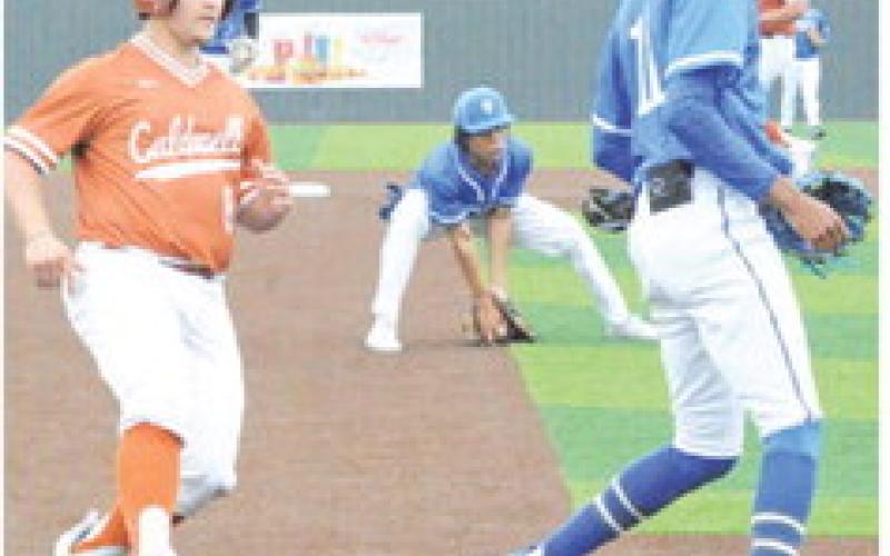 CARSON PARKER OF Caldwell runs to third base against Manor New Tech. -- Tribune photo by Denise Squier