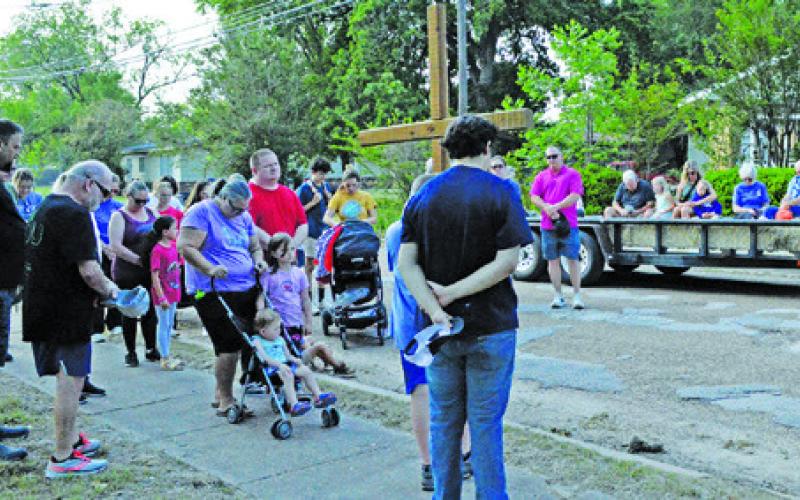 PARTICIPANTS IN LAST FRIDAY’S Cross Walk in Somerville pray during the event. Tribune photo by Kim Hutcheson