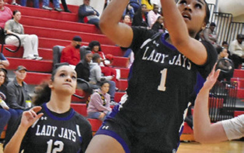 ALANA STRINGFELLOW shoots a layup during the Snook-Bremond game on Friday. Tribune photo by Roy Sanders