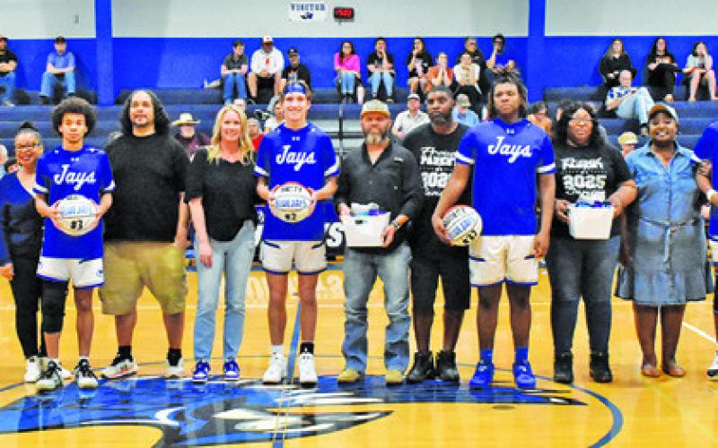 SNOOK HIGH SCHOOL’S seniors are recognized last Friday in their last home game. They included, from left, Max Carter, Brett Withem, Robert Carter and Jeremiah Powell. Tribune photo by Roy Sanders