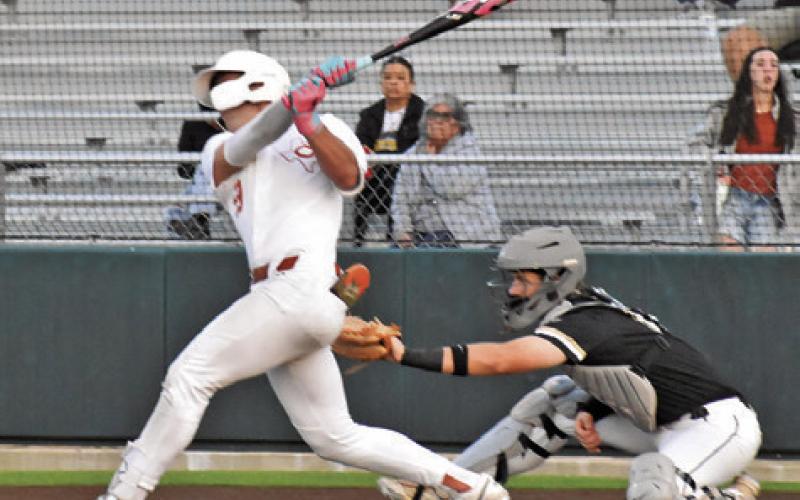 COY BECKA GETS a hit for Caldwell against Giddings last Friday. Tribune photo by Roy Sanders