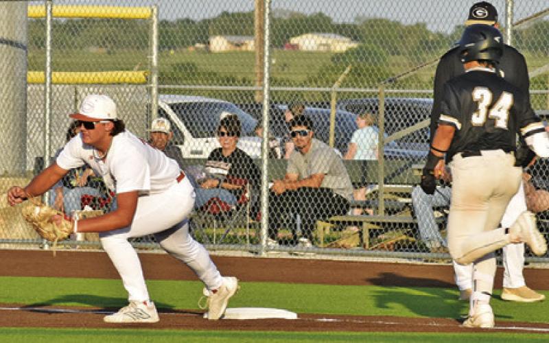 PRESTON SUPAK OF Caldwell makes a catch at first base. Tribune photo by Roy Sanders