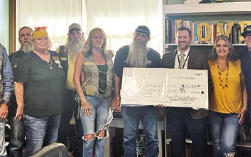 THE CRATER RALLY FAMILY presents Eric Holton with a $5,000 check for the Boys &amp;amp; Girls Club of Somerville at the Tuesday, June 9, city council meeting. Tribune photo by Sabine Lazo
