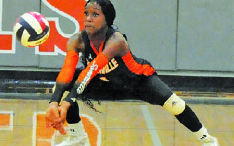JANAYA ISOM gets one of her nine digs during the Somerville-Thorndale bi-district match last Thursday night in Caldwell. Tribune photo by Denise Squier