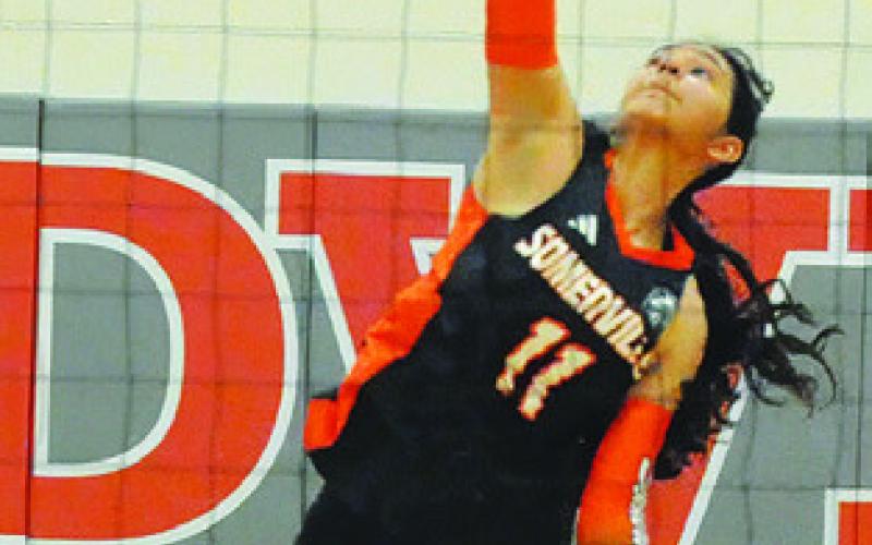 ANETTE REYNA hits the ball from the backline during the Somerville-Thorndale bi-district match last Thursday night. Tribune photo by Denise Squier
