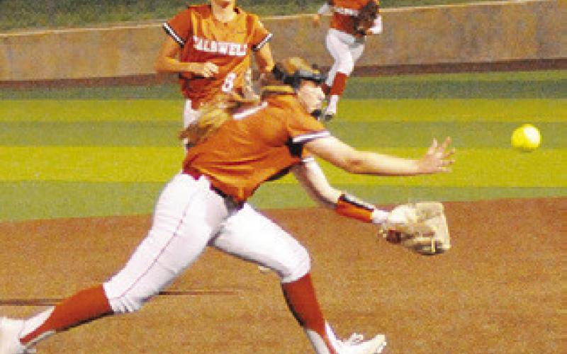 KELLY URBANOVSKY reaches for the fly ball during the Caldwell-Leon game last Friday night.