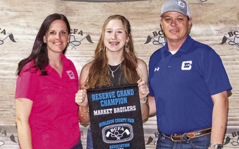 THE RESERVE GRAND Champion winner in Market Broilers is Paisley Sodolak. She is pictured with Adam and Carolyn Janac.