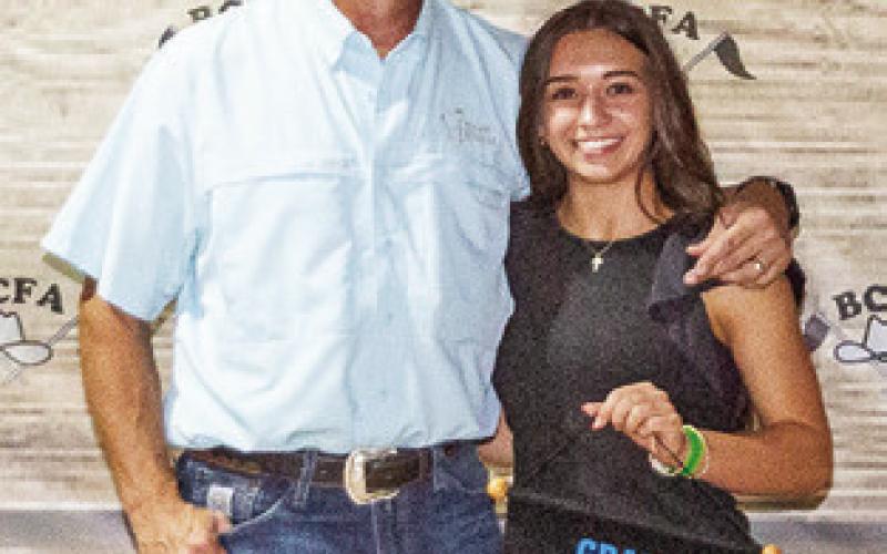 THE GRAND Champion in Market Rabbits was exhibited by Natalie Eastepp. She is pictured with Layne Drgac.