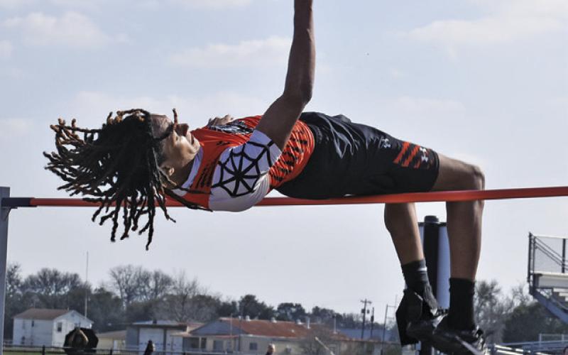 SOMERVILLE’S JEREMY VELA JUMPS at the Bluejay Relays in Snook last Thursday, setting a new Somerville High School record for the boys high jump with a leap of 6 feet 10 inches. Tribune photo by Roy Sanders