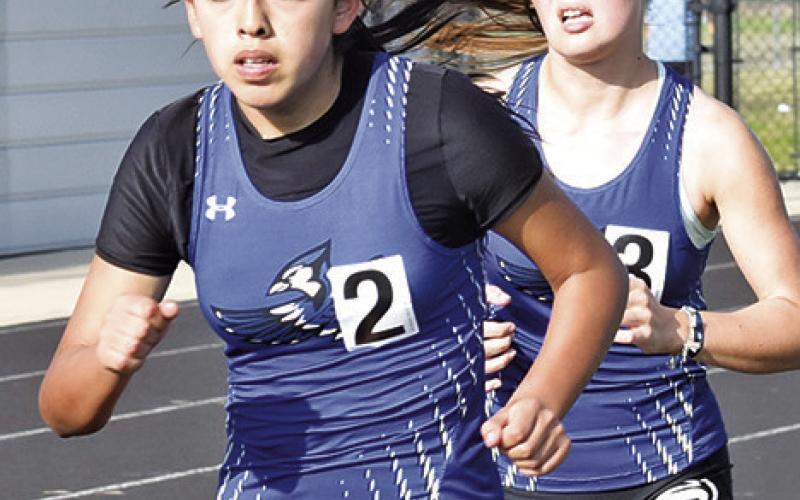 AREA RUNNERS WERE OUT in full force at the Bluejay Relays, including Snook’s Tinia Serrato and Imogen Hott. Tribune photo by Roy Sanders