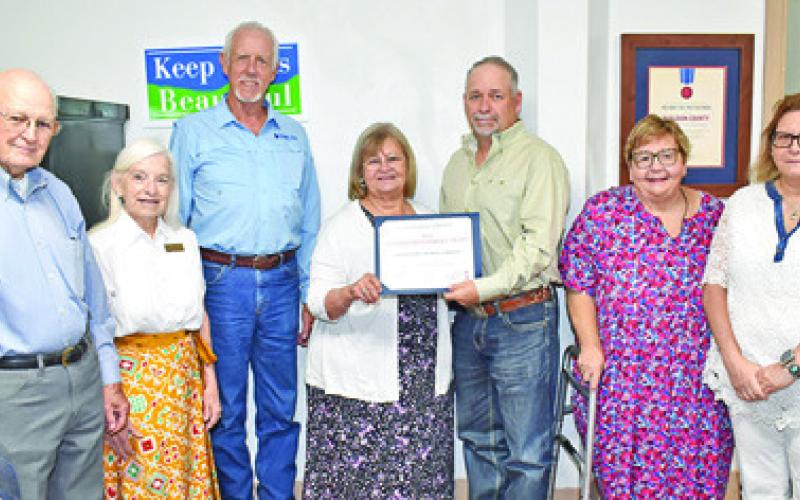 THE BURLESON COUNTY Historical Commission is recognized for its Distinguished Service Award at the Monday Burleson County Commissioners meeting. Pictured are commission members, Tommy Ryan, Windy Tharp, Steve Tunnell, Gayla Townsend, Burleson County Judge Keith Schroeder, Melynda Giesenschlag and Melissa Weichert.