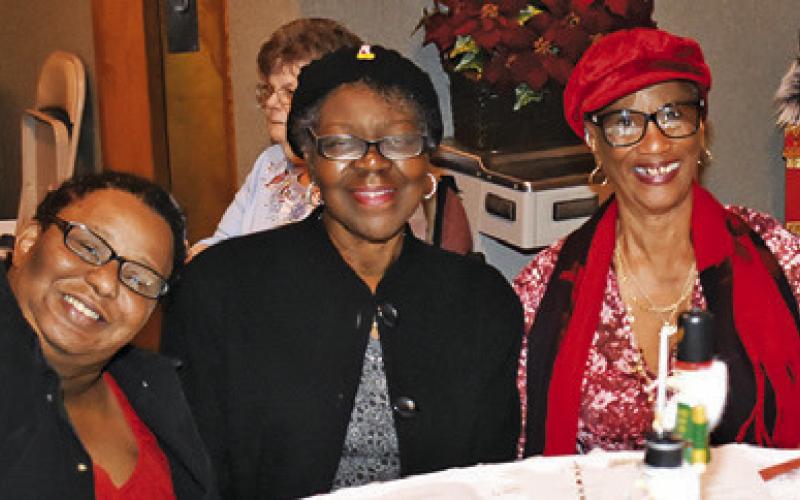 BRANDI SWAIN, DEBRA Coleman and Sharon Hagan enjoy the Angel Tea on Saturday at First United Methodist Church in Somerville.