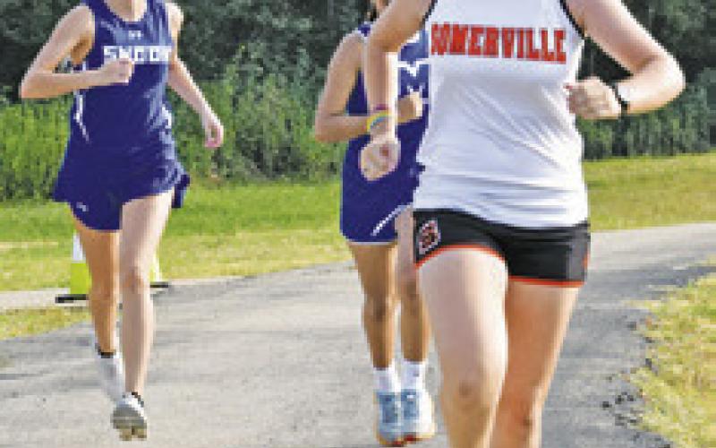 SOMERVILLE’S KYLIE NEVENDORFF (front) finished 16th in last Saturday’s Caldwell Cross Country Invitational. Snook’s Taylor Groce (back left) finished 17th. -- Tribune photo by Roy Sanders