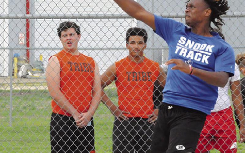 SNOOK’S JEREMIAH POWELL hurls the discus during the District 26-2A Track Meet in Snook last week. He placed fifth. Tribune photo by Denise Squier
