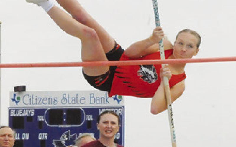 AUBREY FLENCHER attempts to get over the pole in the pole vault during last week’s District 26-2A Track Meet in Snook. Tribune photo by Denise Squier