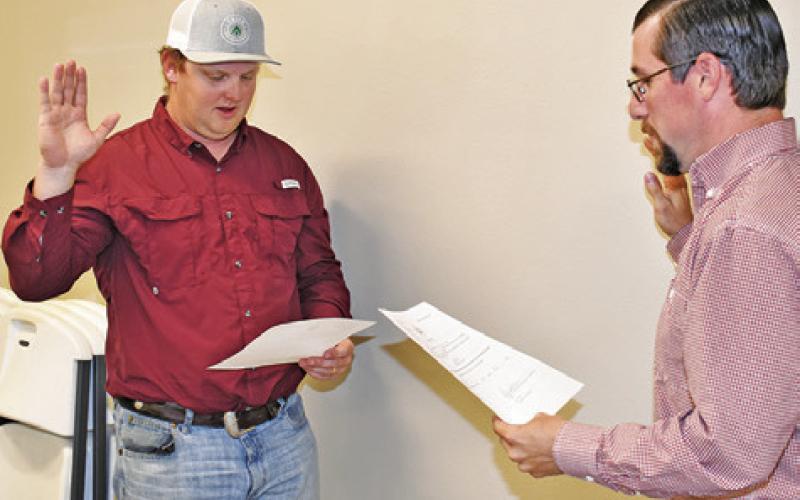 BRADAN HARRIS IS sworn into office on Monday for the Snook City Council. Harris was sworn in by City Administrator David Junek.