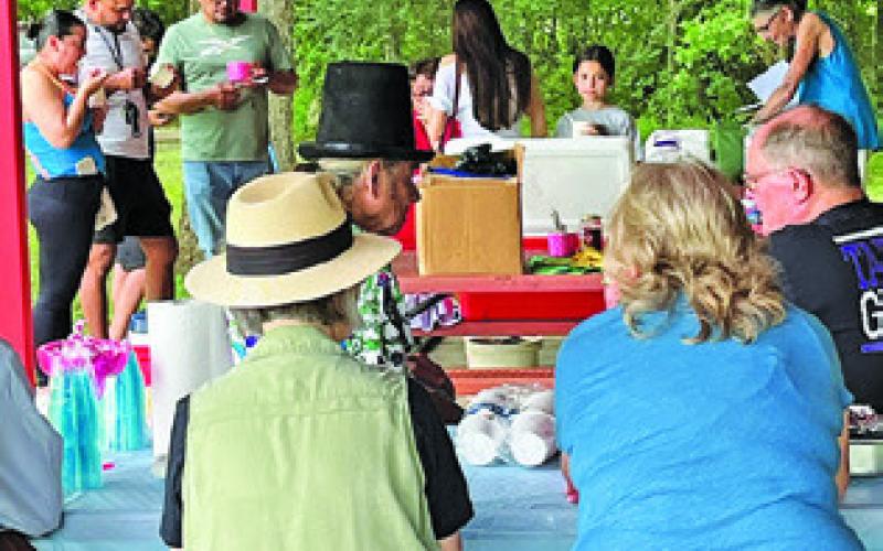 BURLESON COUNTY DEMOCRATS enjoy ice cream at a pavilion at Davidson Creek Park on Sunday, May 18.