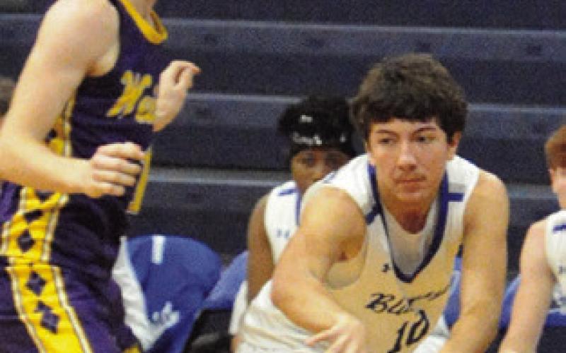 BRAEDYN FANNIN passes the ball against Weimar. Snook won 52-35. Tribune photo by Denise Squier