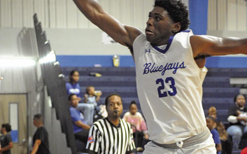 KE’TREEN CARTER reaches for the ball against Weimar, a 52-35 victory. Tribune photo by Denise Squier