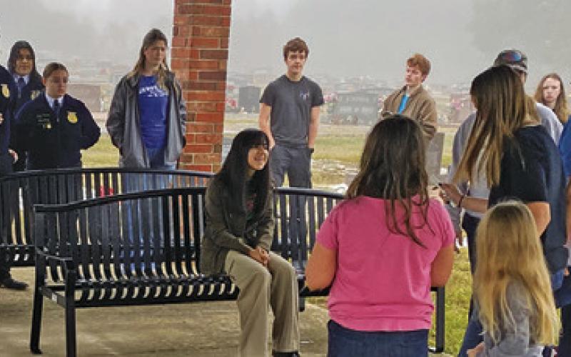 MEMBERS OF THE SNOOK FFA joined Snook residents to place swags on veterans’ graves on Saturday at the Snook Cemetery as part of the “Wreaths Across America” program. Photo courtesy of Steve Tunnell