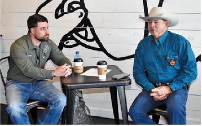 BURLESON COUNTY SHERIFF Bill Rios talks to Ty Eller, the county’s emergency management coordinator, during Coffee With A Cop on Monday, Jan. 12, at Connect Coffee in Caldwell.