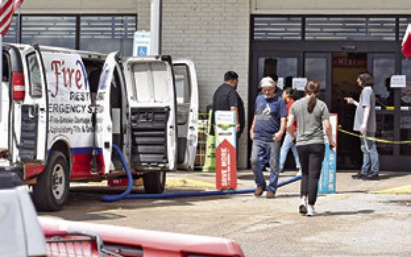 BROOKSHIRE BROTHERS employees greet customers at the store front entrance on Saturday, July 26, in Caldwell.
