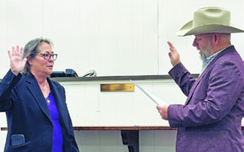 BURLESON COUNTY ATTORNEY Susan Deski is sworn into office by Burleson County Judge Keith Schroeder on Jan. 1.
