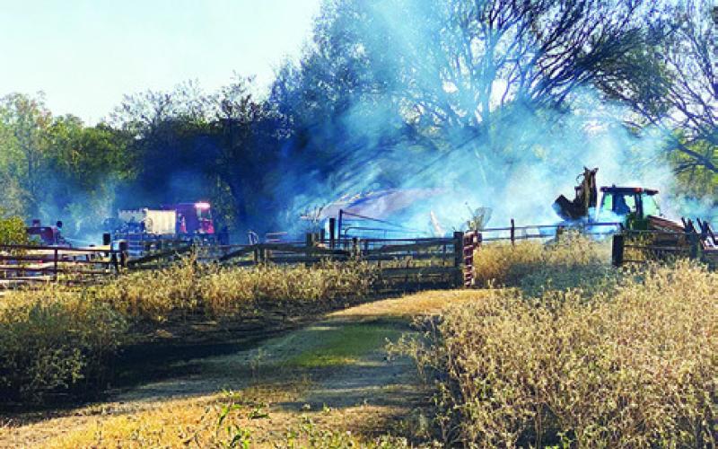 SMOKE IS SEEN coming from this fire on Private Road 4031 off County Road 119 on Oct. 15. The fire burned about 10 acres.
