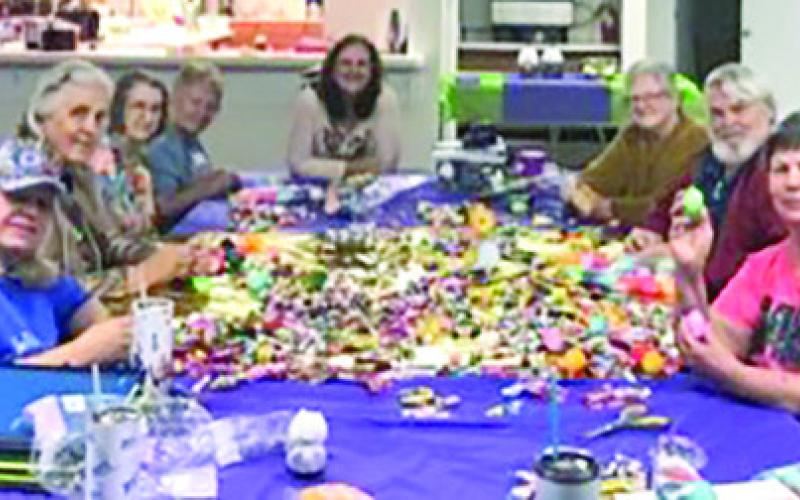 THE LYONS Extension Education Association recently stuffed 33 dozen Easter eggs for the Caldwell 4-H Easter Egg Hunt. Photo courtesy of Lyons EEA