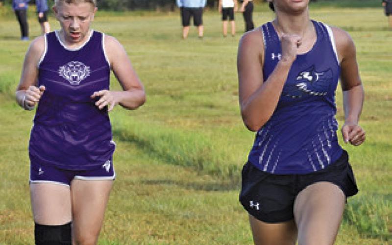 JADE LAUDERDALE approaches the finish line of the Caldwell Cross Country Invitational Meet at Hejl Park at Davidson Creek. Tribune photo by Roy Sanders